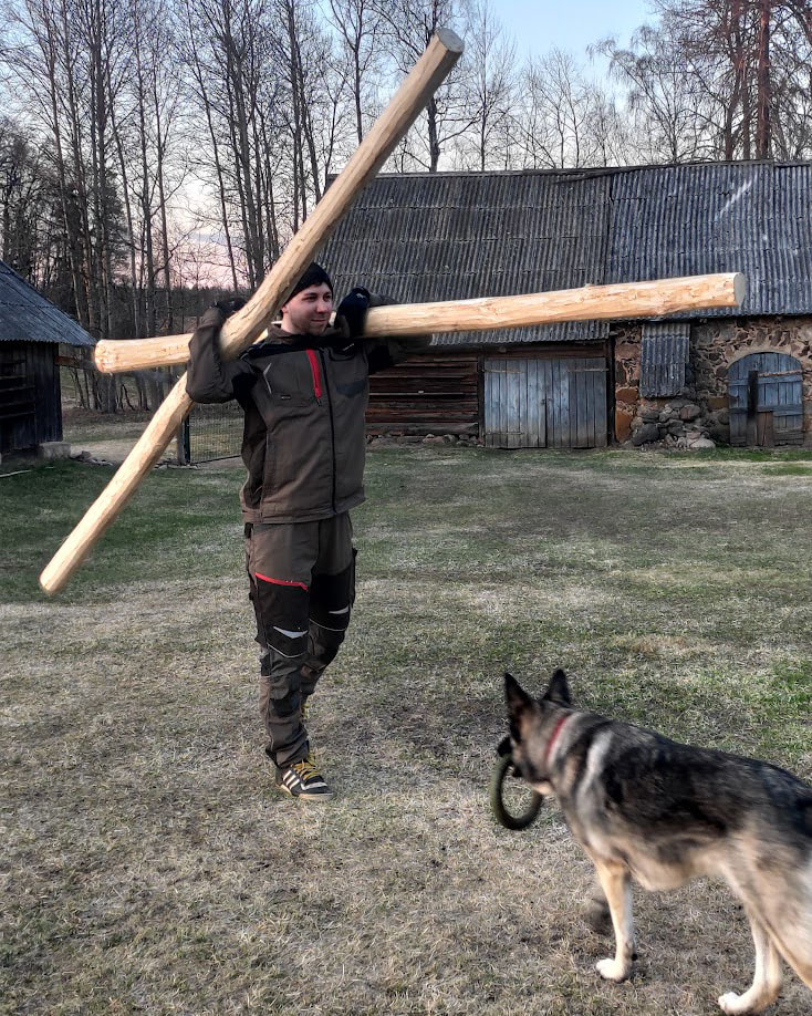 Janis holding lumber pieces